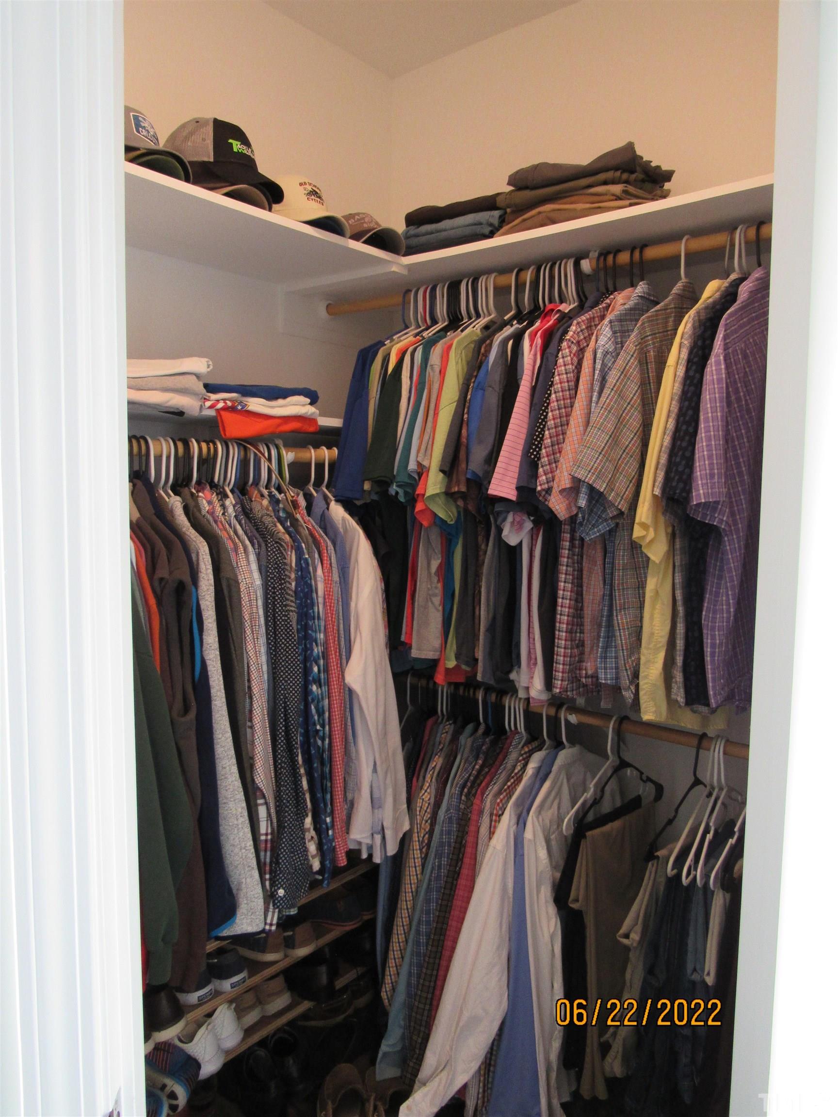 3167 Baileys Crossroads Road Benson, NC 27504 - Photo 8 of 29 a view of walk in closet with clothes and shoes