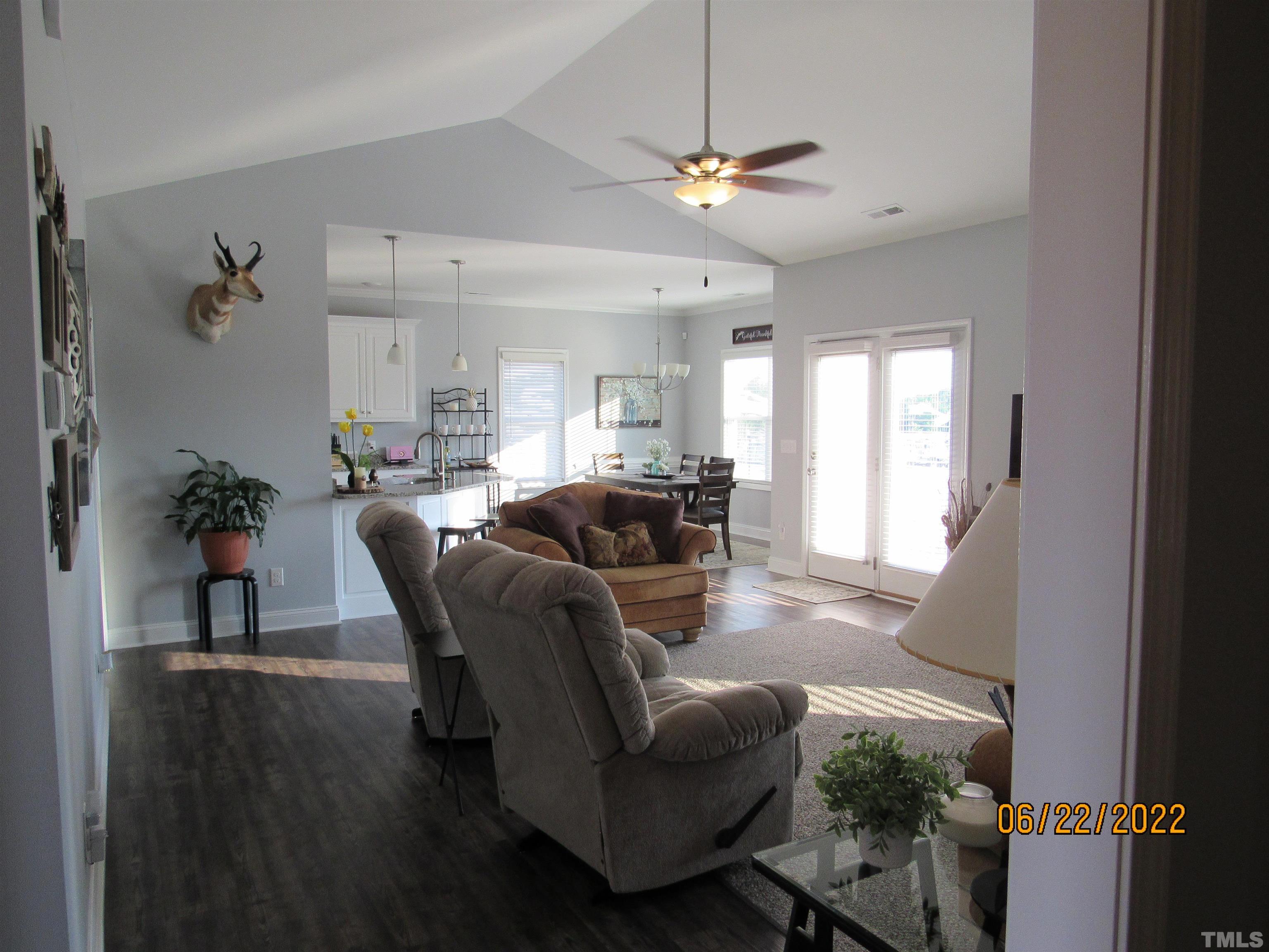 3167 Baileys Crossroads Road Benson, NC 27504 - Photo 10 of 29 a living room with furniture and a chandelier