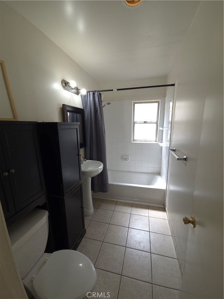 522 Cedar Avenue, Unit 3 Long Beach, CA 90802 - Photo 14 of 14 a bathroom with a sink toilet and shower