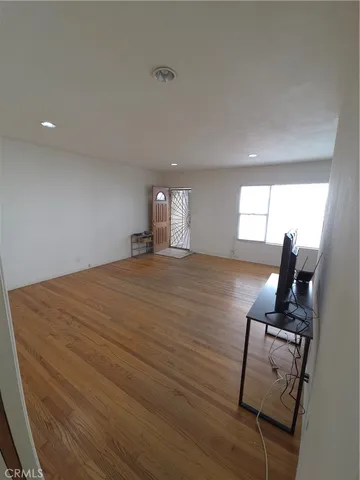 a room with furniture and wooden floor