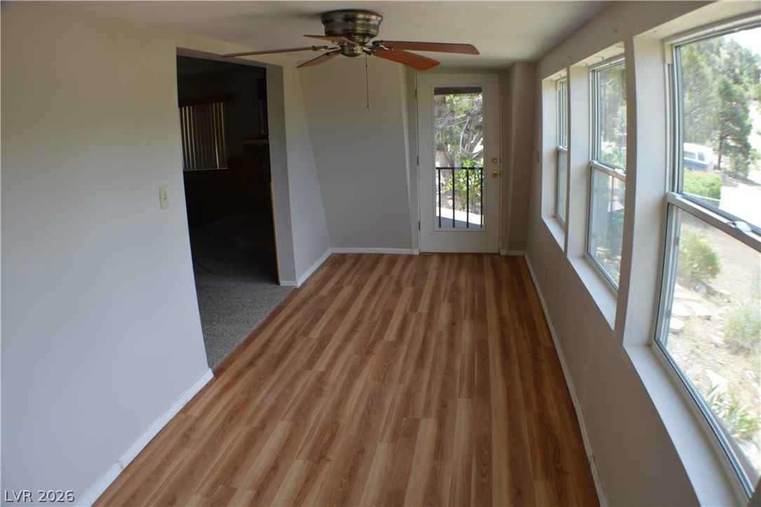 1321 Trout Canyon Road Las Vegas, NV 89124 - Photo 43 of 50 Sun-filled room boasts resilient laminate flooring and a private outdoor access point.