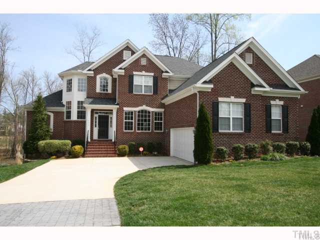 12439 Pawleys Mill Circle Raleigh, NC 27614 - Photo 1 of 12 a front view of a house with a yard and garage
