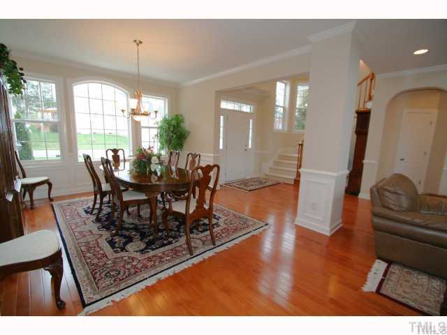 12439 Pawleys Mill Circle Raleigh, NC 27614 - Photo 3 of 12 a view of a dining room with furniture window and wooden floor