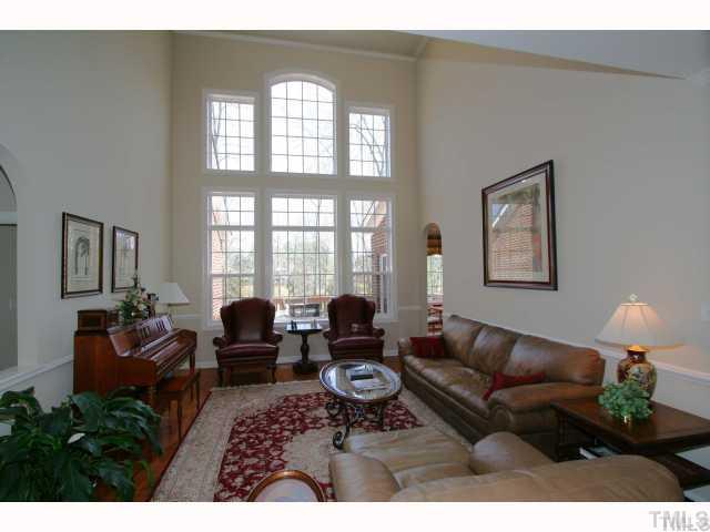 12439 Pawleys Mill Circle Raleigh, NC 27614 - Photo 5 of 12 a living room with furniture large window and lamp