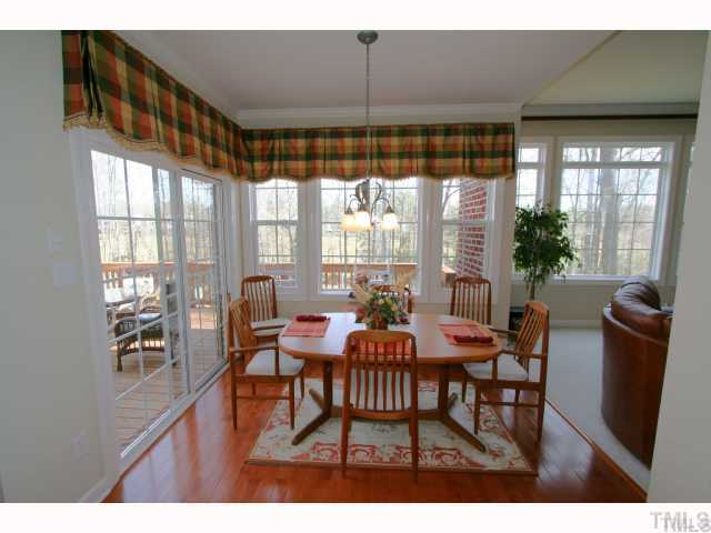 12439 Pawleys Mill Circle Raleigh, NC 27614 - Photo 7 of 12 a dining room with furniture and window