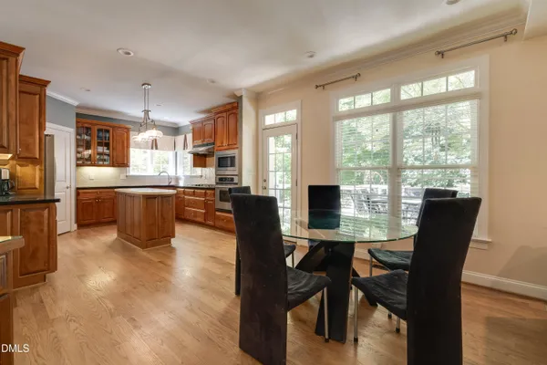 a kitchen with stainless steel appliances granite countertop a stove and a sink