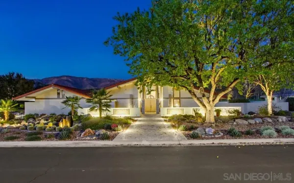 front view of a house with a street