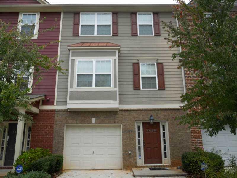Exterior Front. townhome with garage