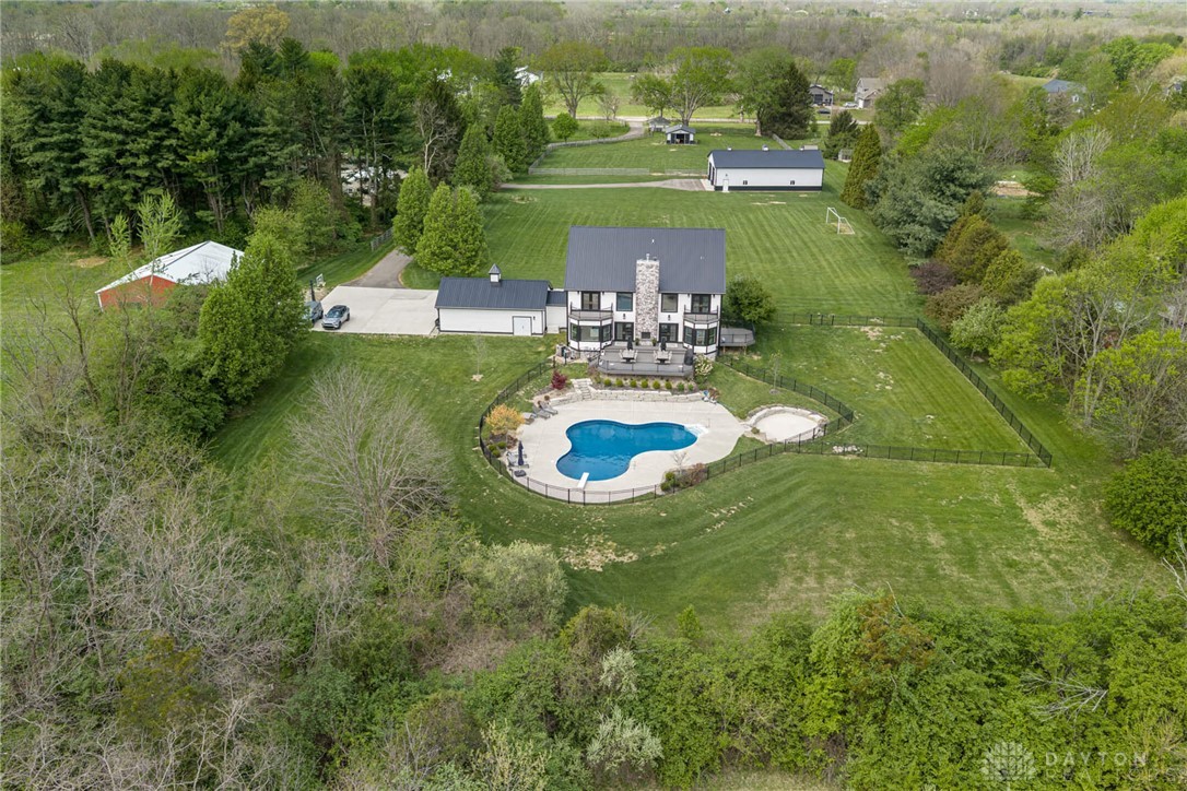 9586 Ferry Road Waynesville, OH 45068 - Photo 28 of 40 This expansive estate offers a private pool, ample grounds, and charming outbuildings for diverse use.