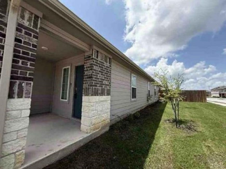 12201 Token Trail Elgin, TX 78621 - Photo 2 of 6 a view of house with backyard