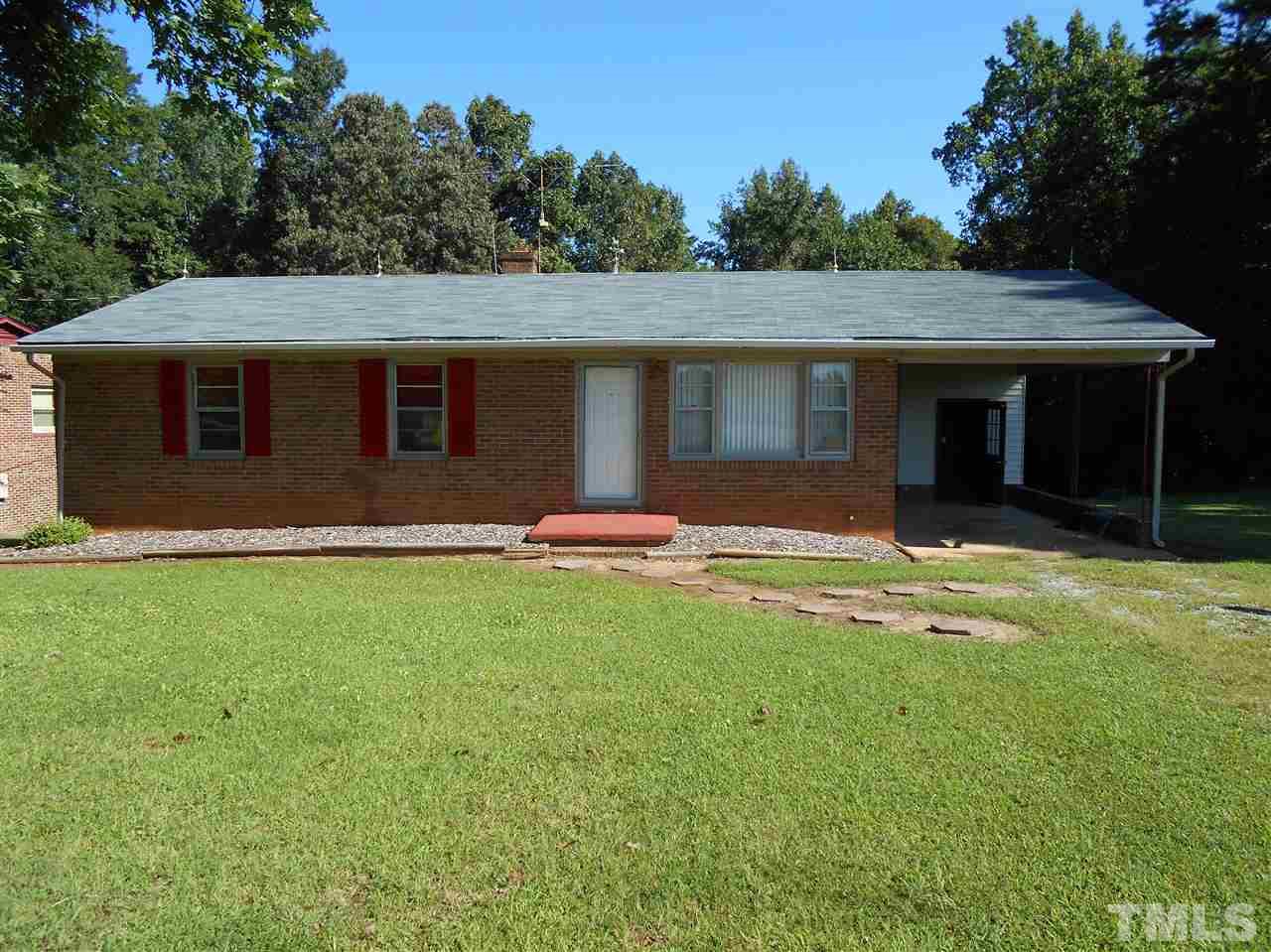 910 Mackfieldson Road Roxboro, NC 27574 - Photo 1 of 10 a backyard of a house