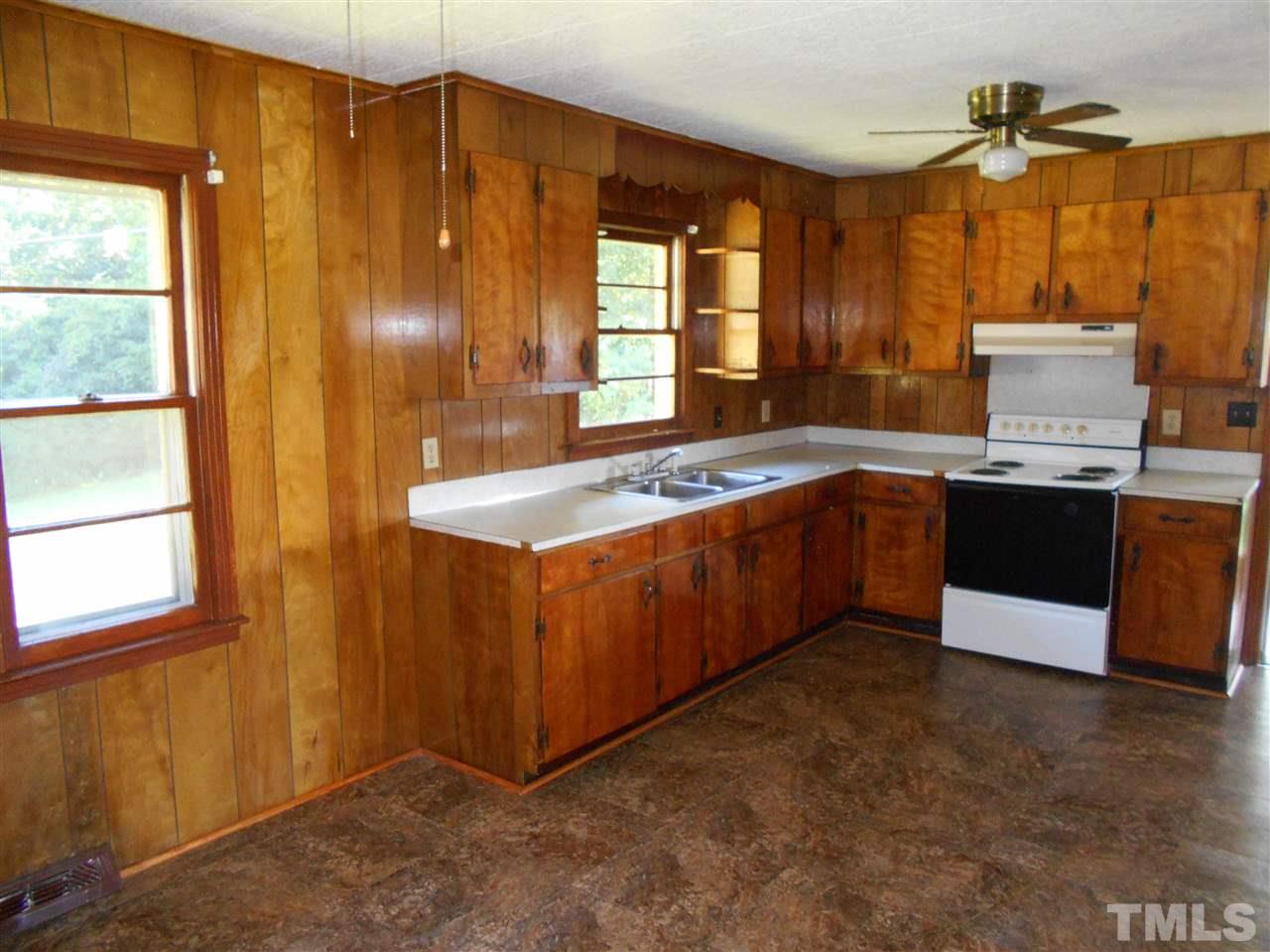 910 Mackfieldson Road Roxboro, NC 27574 - Photo 2 of 10 a kitchen with stainless steel appliances granite countertop a sink and a stove
