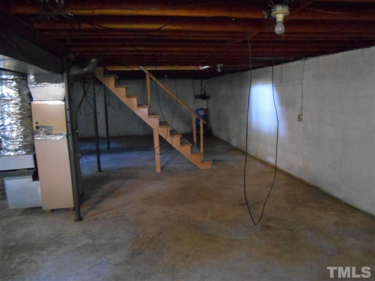 910 Mackfieldson Road Roxboro, NC 27574 - Photo 8 of 10 a view of an empty room with stairs