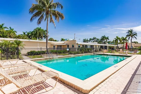 a view of swimming pool with a lounge chair