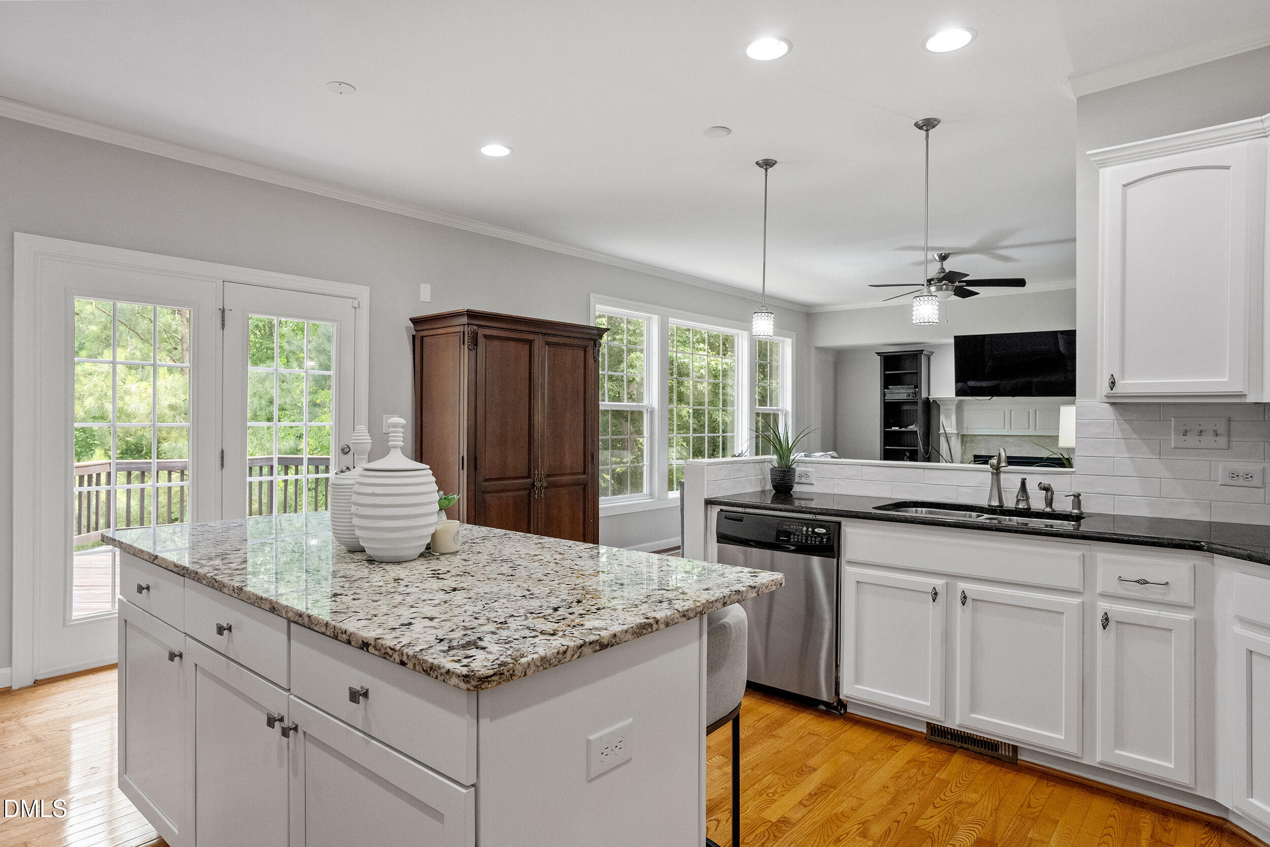 1019 Bianco Drive Raleigh, NC 27607 - Photo 11 of 29 a kitchen with kitchen island granite countertop a sink and cabinets