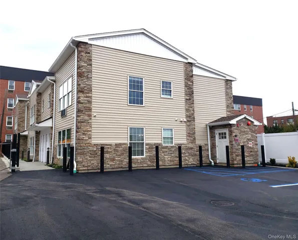 a view of a house with a street
