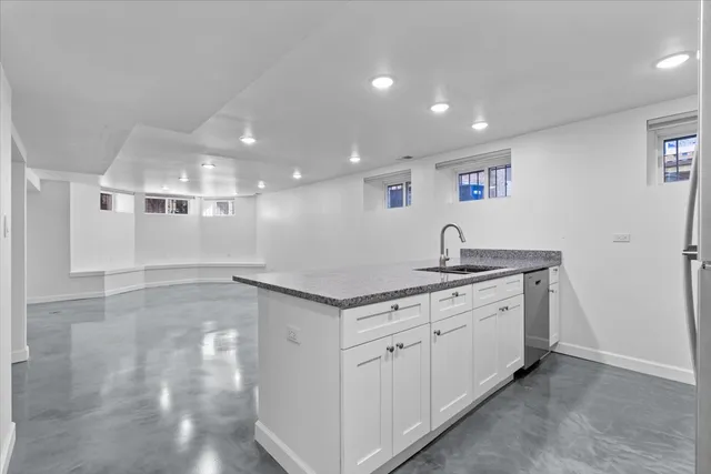 a view of a kitchen with a sink and a dishwasher