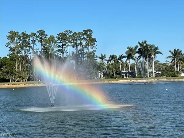 a white car parked in front of a house