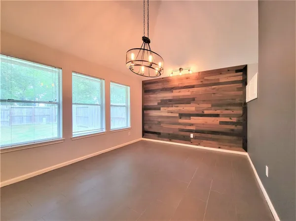 a view of room with window and ceiling fan