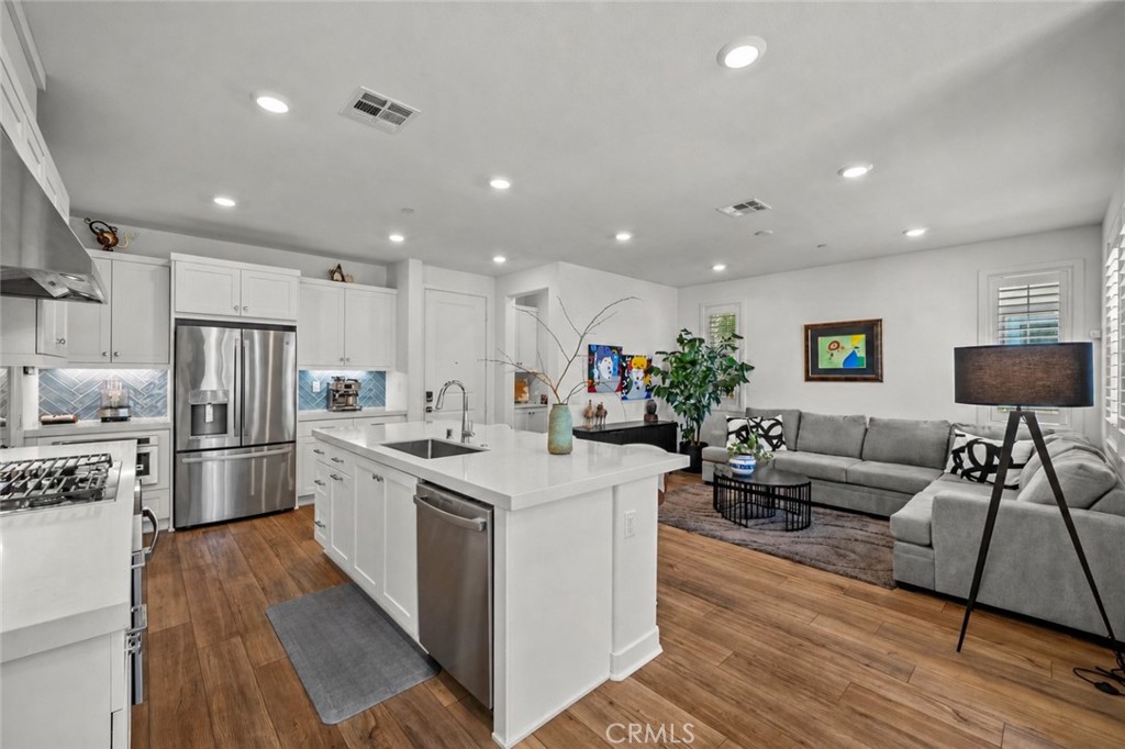 1663 Rosewell Road West Covina, CA 91791 - Photo 1 of 45 a kitchen with stainless steel appliances kitchen island granite countertop a refrigerator and a stove top oven
