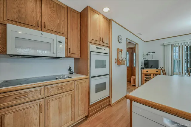 a kitchen with stainless steel appliances granite countertop a refrigerator and cabinets