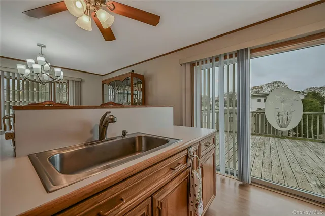 a kitchen with a sink and a refrigerator