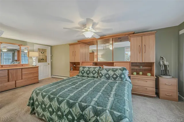 a bedroom with a bed and a cabinets