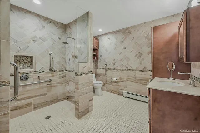 a bathroom with a bathtub sink and toilet