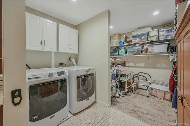 a view of a kitchen with fridge and wooden floor