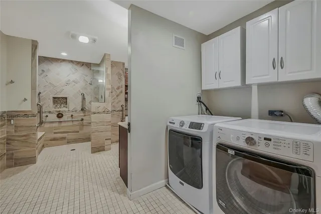 a view of a kitchen with washer and dryer