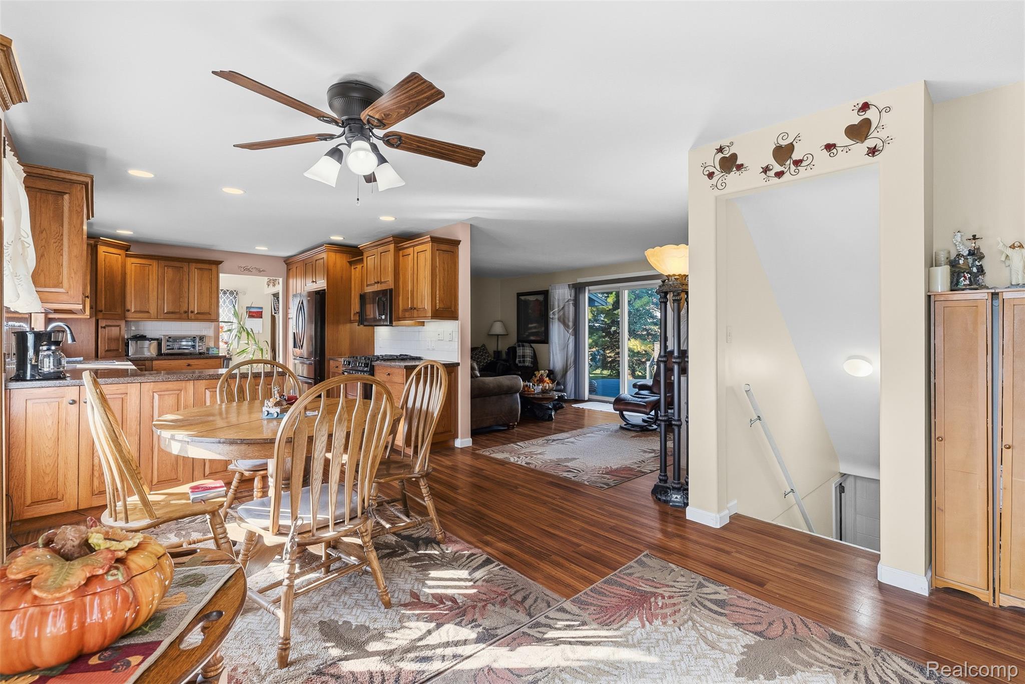 2227 North Graf Road Caro, MI 48723 - Photo 14 of 51 Wood-finish flooring throughout, recessed lighting, and a ceiling fan with light fixture