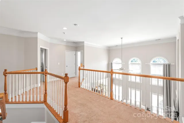 a view of a hallway with windows