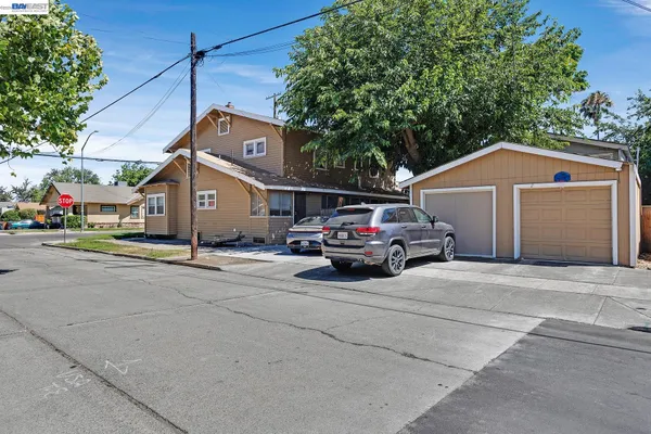 a aerial view of a house with a garden and deck
