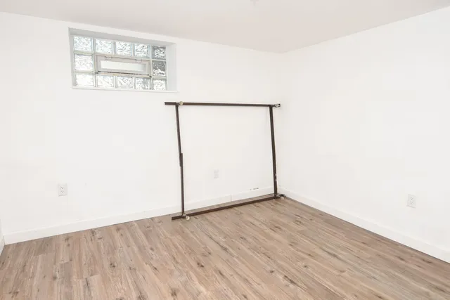 a bathroom with a sink toilet and a mirror