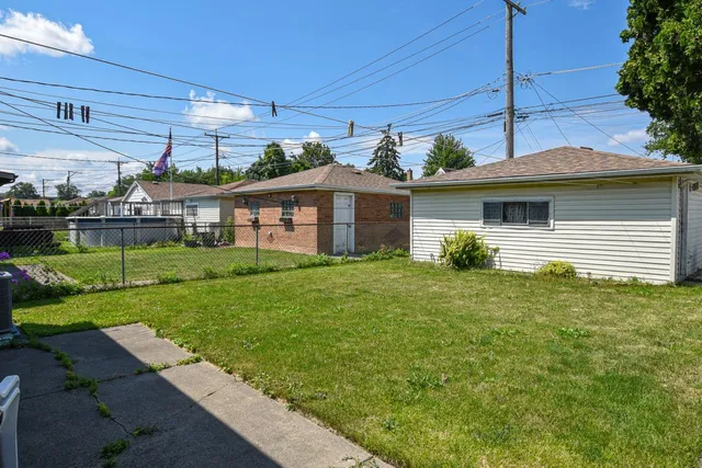 a backyard of a house with lots of green space
