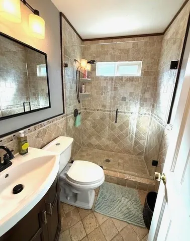 a bedroom with bed and a window