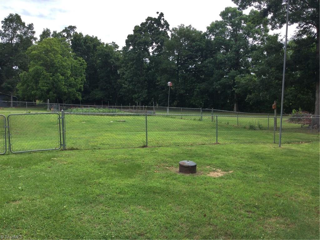 4024 Rural Retreat Road Burlington, NC 27215 - Photo 9 of 50 Partially fenced back yard w/underground propane tank
