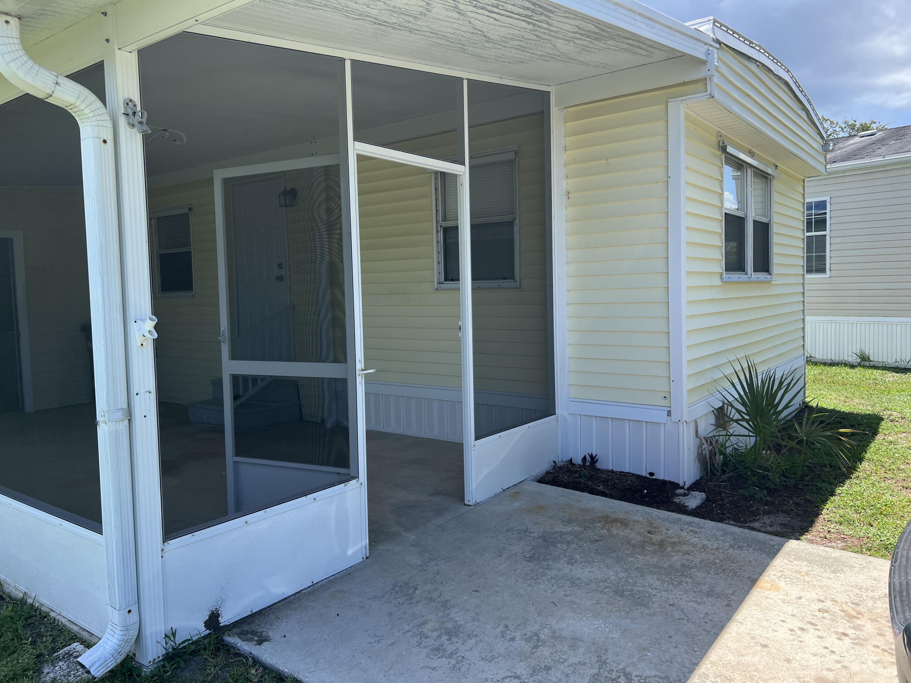 a view of front door and deck of house