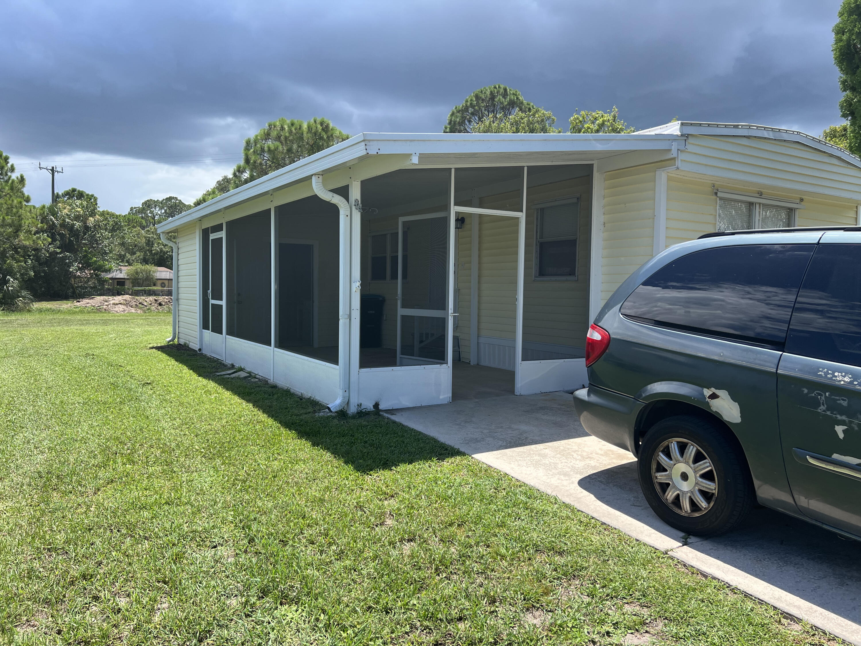 1065 Moonlight Court Palm Bay, FL 32907 - Photo 11 of 11 a view of a car in front of a house
