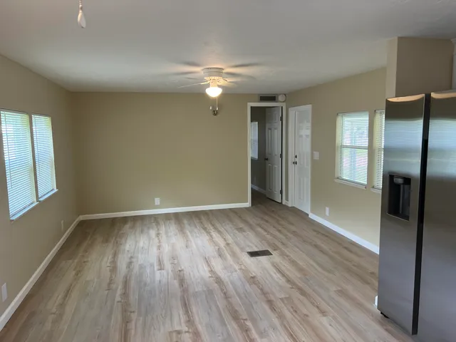 a kitchen with stainless steel appliances granite countertop a stove top oven a sink and dishwasher