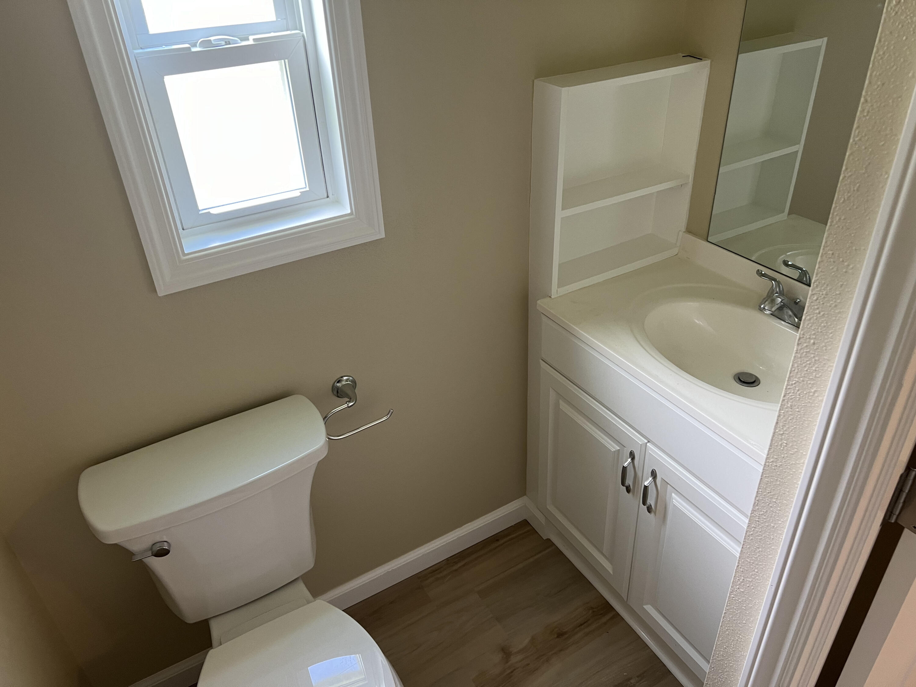 1065 Moonlight Court Palm Bay, FL 32907 - Photo 6 of 11 a bathroom with a sink and a toilet