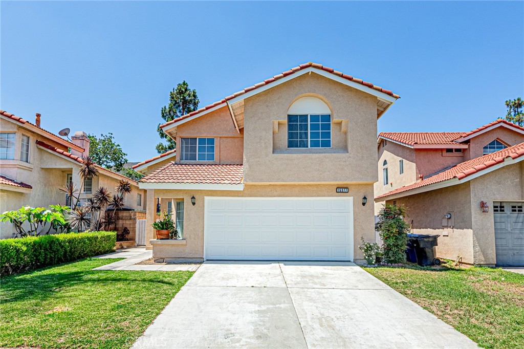 15377 Tobarra Road Fontana, CA 92337 - Photo 4 of 38 Attached 2-car garage and extended driveway for additional parking space