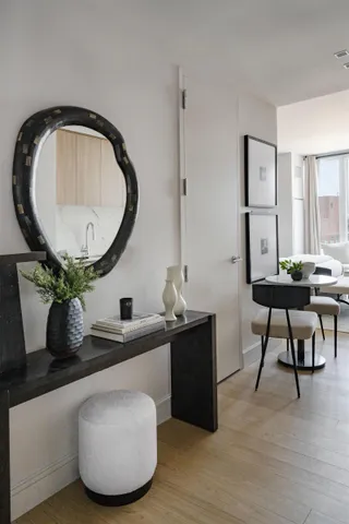 a bathroom with a bathtub sink mirror and toilet