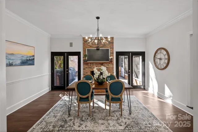 a kitchen with a stove and wooden floor