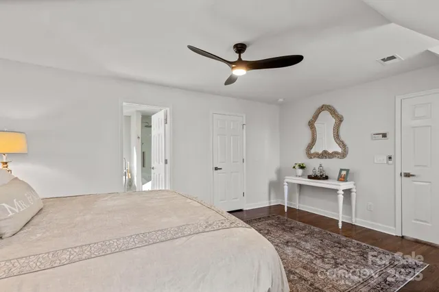 a bathroom with a double vanity sink and mirror
