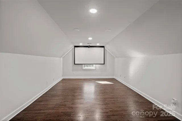 a view of an empty room with a windows