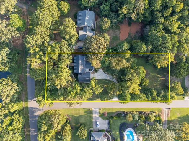 a living room with furniture and large windows