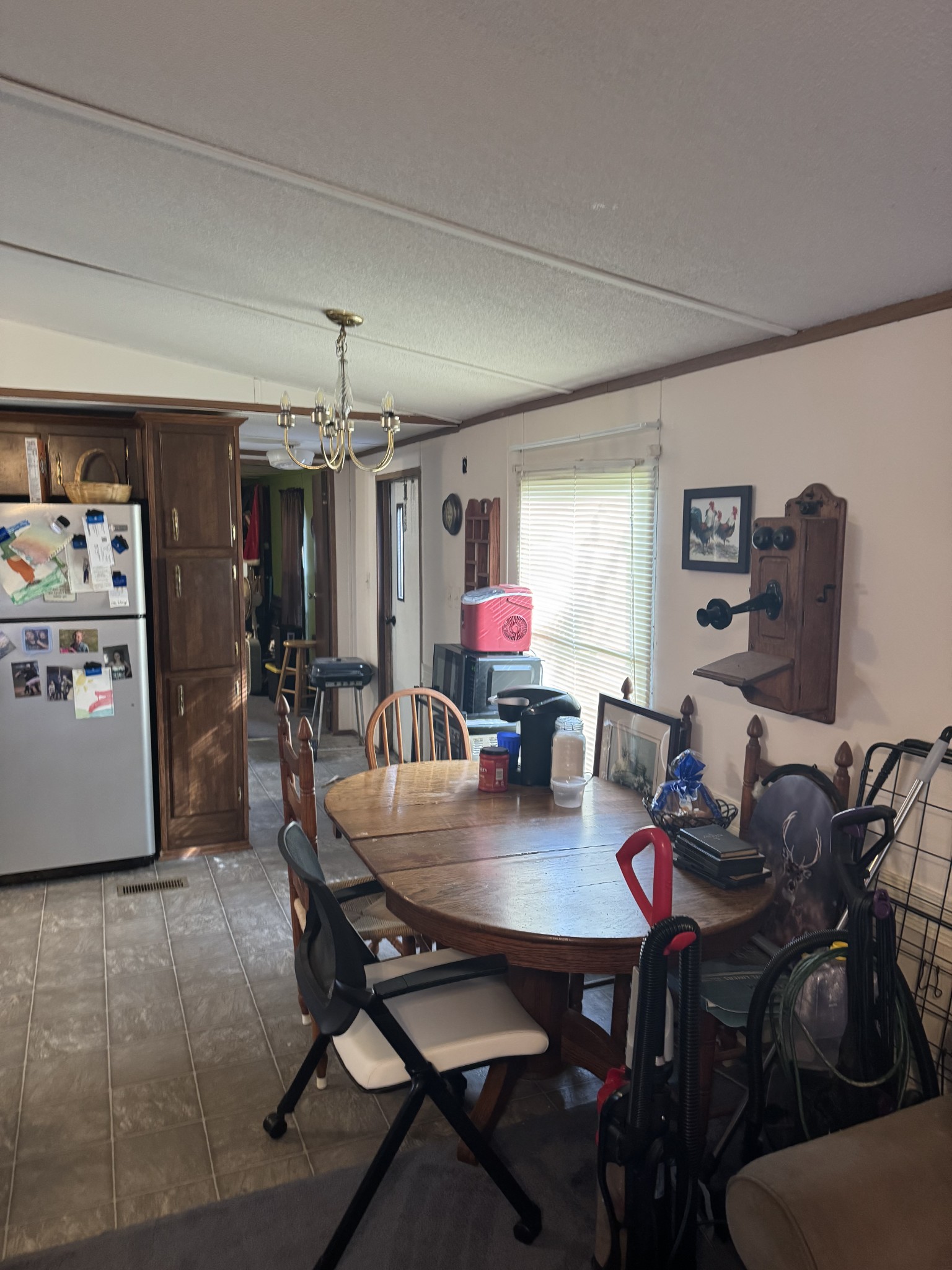 3020 West County Farm Road Springfield, TN 37172 - Photo 7 of 10 a view of a dining room with furniture and chandelier