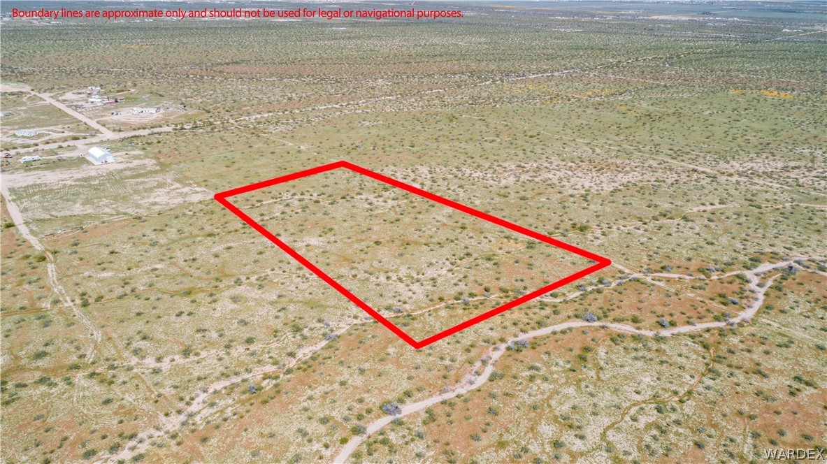 Lot 3 South Concho Road Golden Valley, AZ 86413 - Photo 3 of 22 a view of a bench in a lake