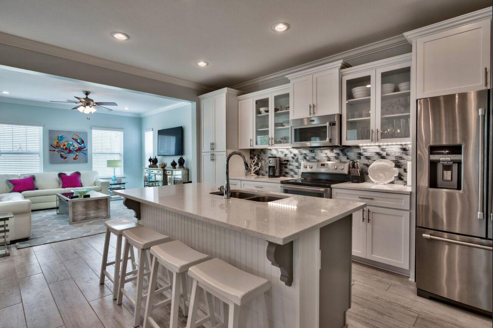 66 Sandpine Loop Inlet Beach, FL 32461 - Photo 11 of 41 a kitchen with stainless steel appliances granite countertop a refrigerator and a stove top oven